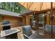 Relaxing deck featuring comfortable seating, a dining area, and a grill, perfect for outdoor entertaining and enjoying the scenery at 6605 Old White Mill Rd, Fairburn, GA 30213
