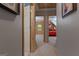 Hallway with a view to rooms with log walls, carpet flooring, and open doorways for a seamless transition at 6605 Old White Mill Rd, Fairburn, GA 30213
