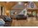 Cozy living room features wood accents, comfortable seating, and easy access to the kitchen and staircase at 6605 Old White Mill Rd, Fairburn, GA 30213