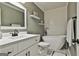 Bathroom featuring a modern soaking tub, white vanity, and decorative shelving at 150 Whitney Way, Fayetteville, GA 30214