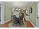 Breakfast nook with hardwood floors and views into the kitchen at 150 Whitney Way, Fayetteville, GA 30214