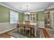 Charming dining room with natural light and a built-in display cabinet for elegant storage at 150 Whitney Way, Fayetteville, GA 30214