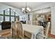 Open dining area connecting to the living room, featuring stylish chandelier and natural light at 150 Whitney Way, Fayetteville, GA 30214