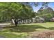 Charming ranch home features a spacious front yard, stone accents, and manicured landscaping at 150 Whitney Way, Fayetteville, GA 30214
