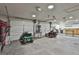 Spacious garage interior featuring multiple garage doors, lighting, and ample space for equipment and storage at 150 Whitney Way, Fayetteville, GA 30214