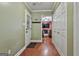 Hallway features hardwood floors, closet, and a glimpse into the living room, providing a warm and inviting transition space at 150 Whitney Way, Fayetteville, GA 30214