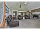 Spacious living room with stone fireplace, vaulted ceiling, and comfortable leather seating at 150 Whitney Way, Fayetteville, GA 30214