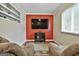 Cozy living room features a flat-screen TV, two reclining chairs, and a warm and inviting atmosphere with neutral tones at 150 Whitney Way, Fayetteville, GA 30214