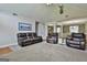 Cozy living room with a stone fireplace, vaulted ceiling, and comfortable leather furniture at 150 Whitney Way, Fayetteville, GA 30214
