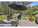 Patio featuring comfortable seating and an umbrella for shade at 150 Whitney Way, Fayetteville, GA 30214