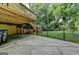 Backyard patio underneath the deck, fenced-in lawn, and outdoor play set at 1486 Maple Ridge Dr, Suwanee, GA 30024