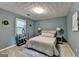 Comfortable bedroom with neutral paint, carpet, matching nightstands, and decorative lighting at 1486 Maple Ridge Dr, Suwanee, GA 30024