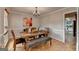 Inviting dining room featuring a rustic wood table and access to the living room at 1486 Maple Ridge Dr, Suwanee, GA 30024