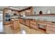 Functional kitchen with wood cabinets, stainless steel appliances, and a convenient kitchen island at 1486 Maple Ridge Dr, Suwanee, GA 30024
