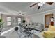 Comfortable living room with large windows and stylish, neutral decor at 1486 Maple Ridge Dr, Suwanee, GA 30024