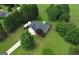 Bird's eye view of a residential home showcasing lush green spaces and RV parking at 105 Carols Ln, Locust Grove, GA 30248