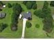 Overhead view of a single-Gathering home featuring well-maintained landscaping and a long driveway at 105 Carols Ln, Locust Grove, GA 30248