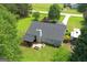 Aerial view of the property with large backyard and patio area at 105 Carols Ln, Locust Grove, GA 30248