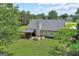 Aerial view of home, showcasing backyard, patio, and surrounding greenery at 105 Carols Ln, Locust Grove, GA 30248