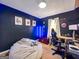 Bedroom with blue lighting featuring gaming console, chair, and gaming desk at 105 Carols Ln, Locust Grove, GA 30248