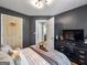 Bedroom with neutral toned bed, soft carpet, and a en-suite bathroom at 105 Carols Ln, Locust Grove, GA 30248