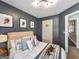 Neutral toned bedroom featuring a soft carpet, natural light, and an open door at 105 Carols Ln, Locust Grove, GA 30248