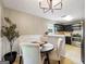 Dining area view into the modern kitchen featuring stainless steel appliances and abundant cabinet space at 105 Carols Ln, Locust Grove, GA 30248