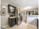 Kitchen showcasing stainless steel refrigerator and black cabinetry with convenient serving area at 105 Carols Ln, Locust Grove, GA 30248