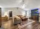 Inviting living room with a fireplace, comfortable seating, and a decorative rug on hardwood flooring at 105 Carols Ln, Locust Grove, GA 30248