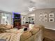 Spacious living room featuring comfortable seating, a fireplace, and an open layout perfect for entertaining guests at 105 Carols Ln, Locust Grove, GA 30248
