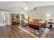 Comfortable living room with a cozy sofa, hardwood floors, and stylish decor creating a warm and inviting space at 105 Carols Ln, Locust Grove, GA 30248