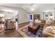 Inviting living room with hardwood floors, comfortable seating, and a stylish rug creating a cozy atmosphere at 105 Carols Ln, Locust Grove, GA 30248