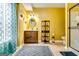 Bathroom with vanity, round mirror, shelf and glass shower with silver hardware at 1373 Fall River Dr, Conyers, GA 30013