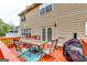 Outdoor deck featuring a dining table with chairs, grill, and colorful rug at 1373 Fall River Dr, Conyers, GA 30013