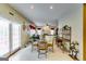 Bright dining area featuring a glass-top table, ornate chairs, and sliding doors with natural light at 1373 Fall River Dr, Conyers, GA 30013