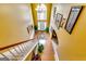 Grand foyer with a high ceiling, chandelier, staircase, and hardwood flooring leading to the entrance at 1373 Fall River Dr, Conyers, GA 30013