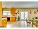 Bright kitchen featuring a breakfast area with a glass table, tile floors and a door to the backyard at 1373 Fall River Dr, Conyers, GA 30013