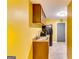 Compact kitchenette features wood cabinets, sink, microwave, and a black refrigerator at 1373 Fall River Dr, Conyers, GA 30013