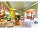 Cozy living room with neutral colors, plush seating, and an open archway leading to the dining area at 1373 Fall River Dr, Conyers, GA 30013