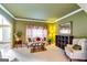 Serene living room with a window, comfortable sofa, and a view of an open archway at 1373 Fall River Dr, Conyers, GA 30013
