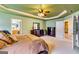 Spacious main bedroom featuring neutral-toned walls and carpet, and dark furniture at 1373 Fall River Dr, Conyers, GA 30013