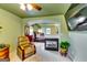 Open-concept main bedroom with fireplace, sitting area, and doorway to sleeping quarters at 1373 Fall River Dr, Conyers, GA 30013