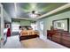 The main bedroom features a decorative ceiling, a fireplace, and ample natural light from the window at 1373 Fall River Dr, Conyers, GA 30013