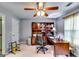 Well-lit home office showcases a built-in desk, storage shelves, and a comfortable workspace at 1373 Fall River Dr, Conyers, GA 30013