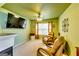 Bright sitting area with natural light, fireplace, and comfortable leather seating at 1373 Fall River Dr, Conyers, GA 30013