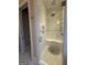 Modern shower with glass door, white tile, and chrome fixtures at 10583 Serenbe Ln, Palmetto, GA 30268