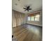 Large bedroom with hardwood floors, neutral paint and large windows at 10583 Serenbe Ln, Palmetto, GA 30268