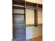 Custom closet with open shelving and drawers for maximum storage and organization at 10583 Serenbe Ln, Palmetto, GA 30268