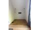 Bright room with hardwood flooring, light fixtures, fresh white paint, and modern decor at 10583 Serenbe Ln, Palmetto, GA 30268