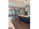 Spacious kitchen with a large island, modern appliances, and lots of natural light at 10583 Serenbe Ln, Palmetto, GA 30268